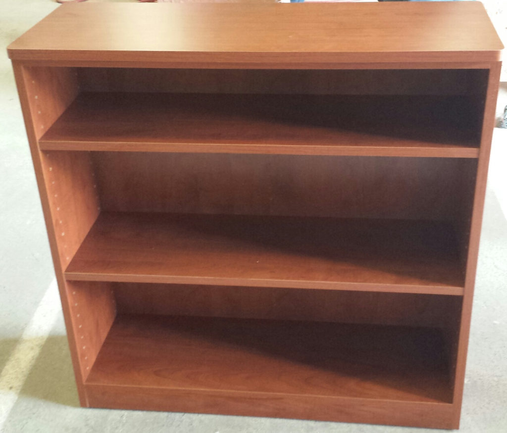 Small woodgrain bookcase with adjustable shelves